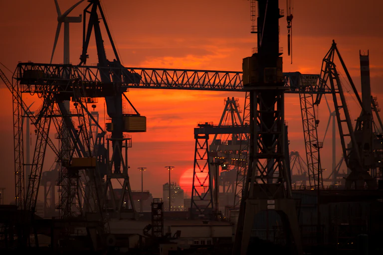 An oil field against a sunset