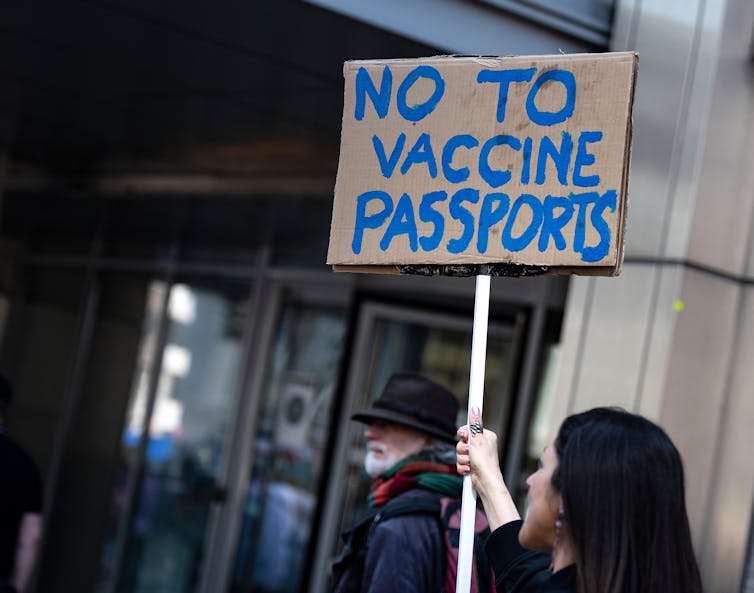Woman holding a sign