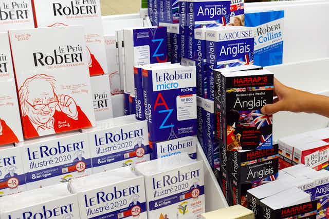 A row of French dictionaires in a store. 