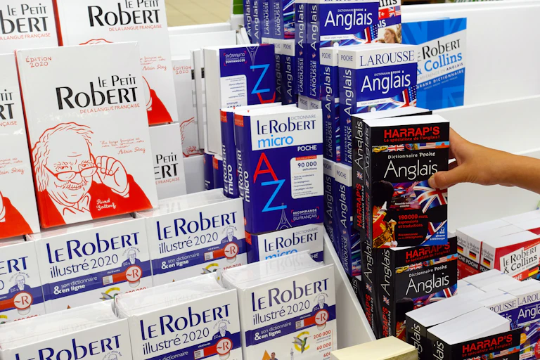 A row of French dictionaires in a store.