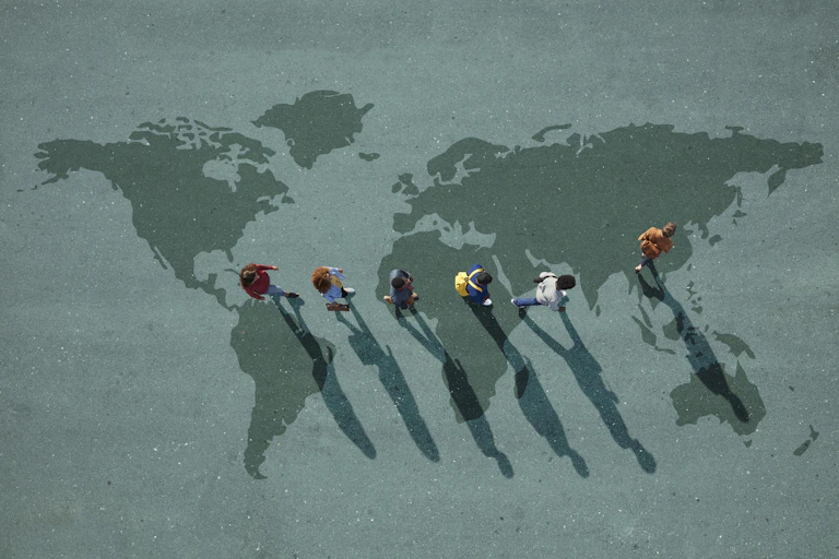 A graphic of a group of people walking across a map.