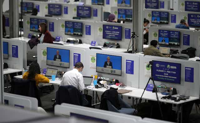 Journalists working at COP26, a global climate change summit