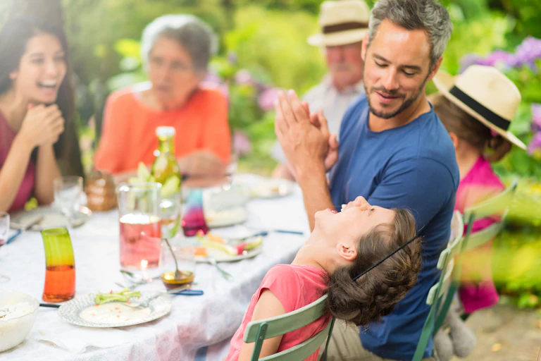 Family having Christmas lunch outdoors