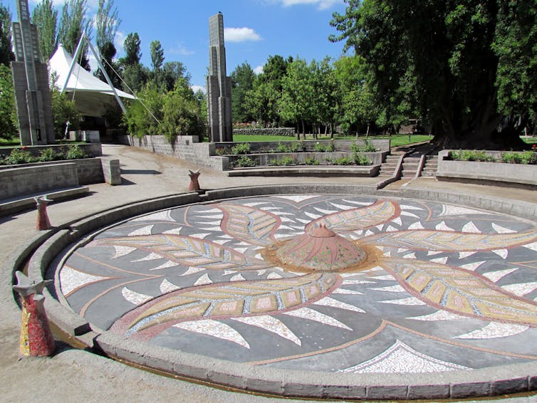 A stone mural in a park