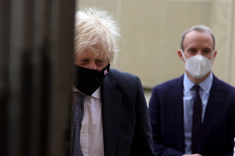 Prime Minister Boris Johnson and Justice Minister Dominic Raab wearing COVID facemaks.