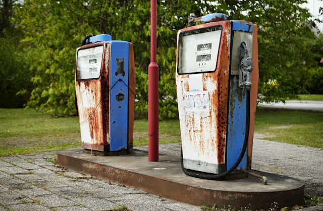 Two old rust gas pumps. 