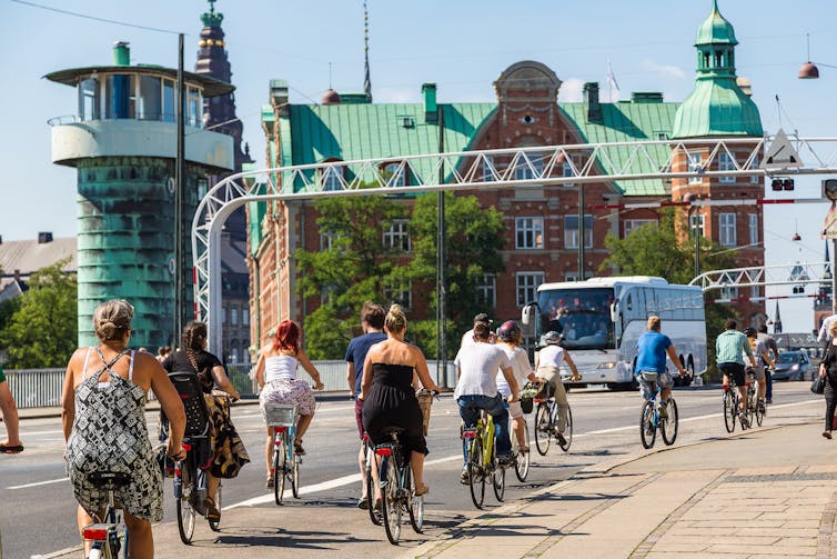 Cyclists on a road in Copenhagen city centre.