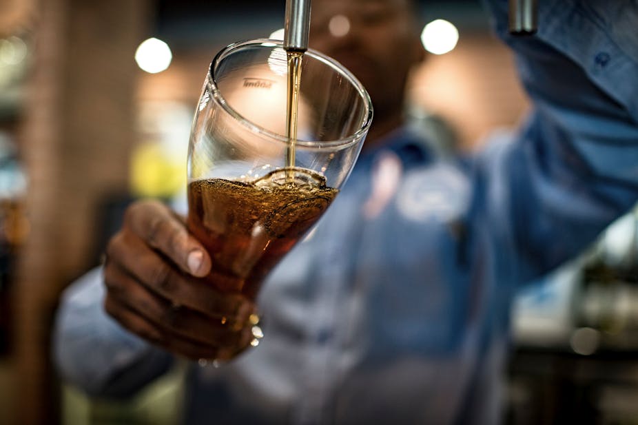 close-up of beer pouring in glass