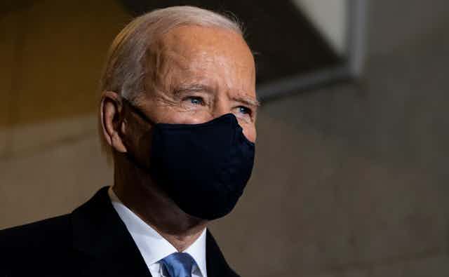 US president Joe Biden wearing a face mask