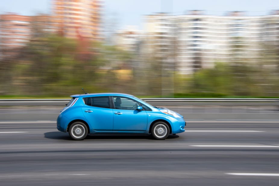 Nissan Leaf moving down a blurry road