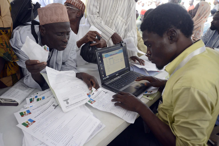 Delegate gets accredited for the opposition All Progressives Congress (APC) convention during the party's presidential primary in Lagos on December 10, 2014.