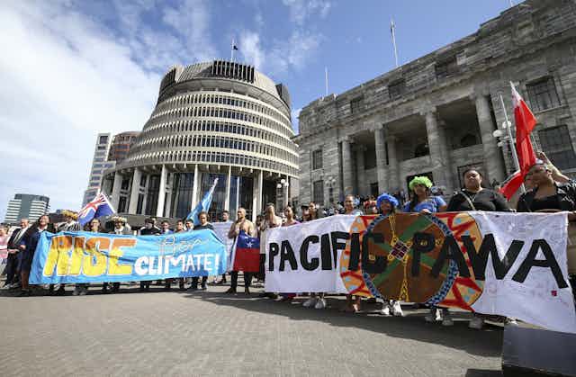 Climate protets soutside New Zealand's parliament.