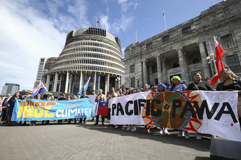 Climate protets soutside New Zealand's parliament.