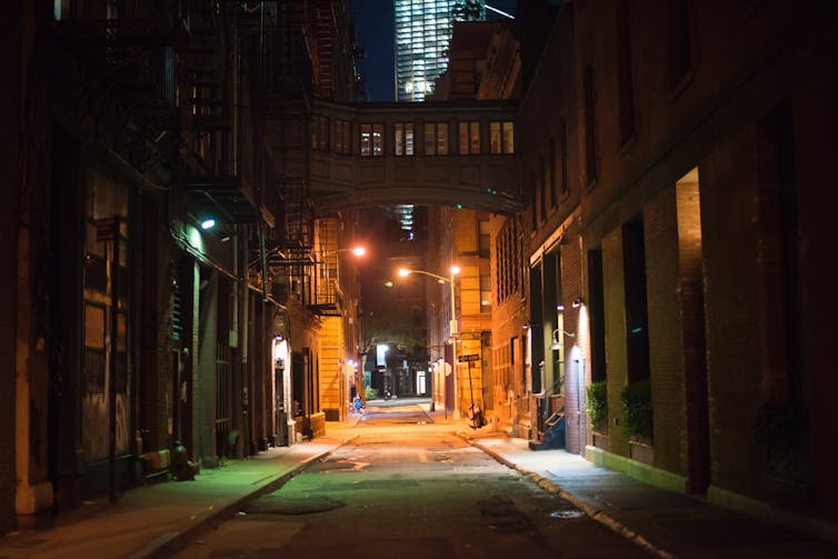 A city alley at night.