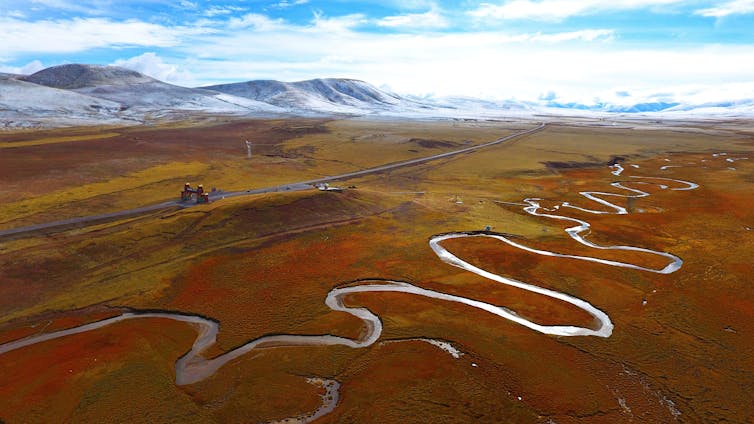 River winds through large valley