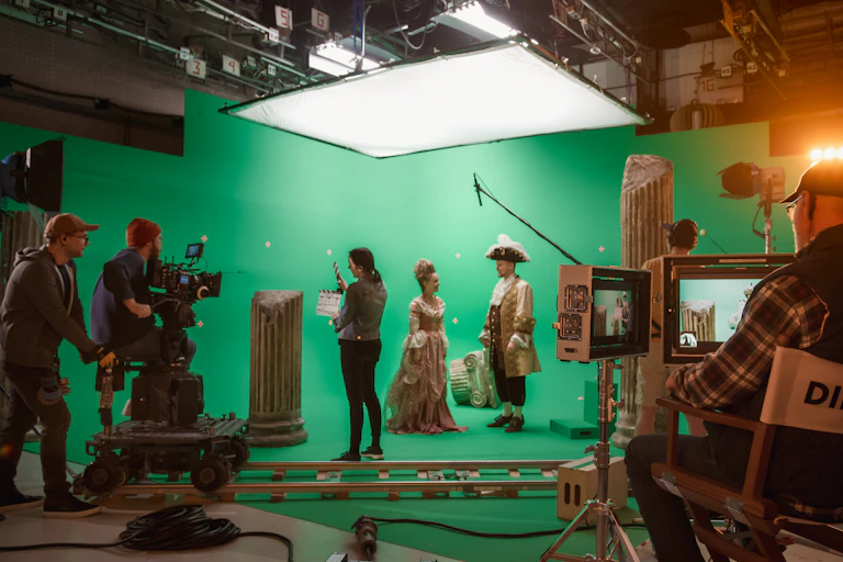 On a film set with greenscreen.