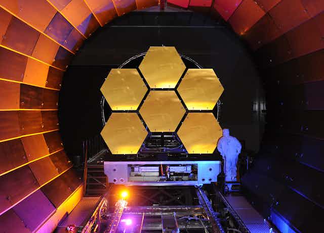 Image of the James Webb Space Telescope mirrors undergoing cryogenic testing.
