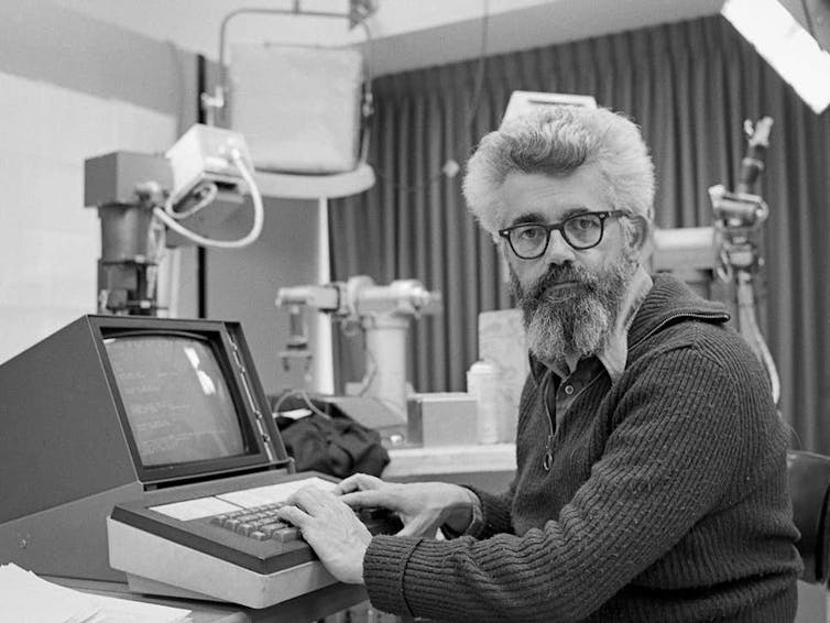 Computer scientist John McCarthy, who coined the term 'AI', at work in his laboratory at Stanford University.