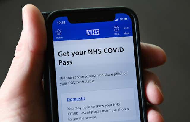 A phone screen showing an NHS COVID pass