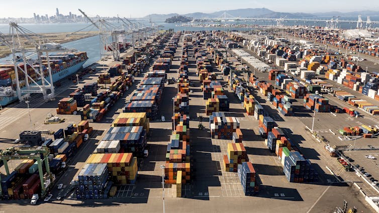 Thousands of shipping containers stacked on a dock.