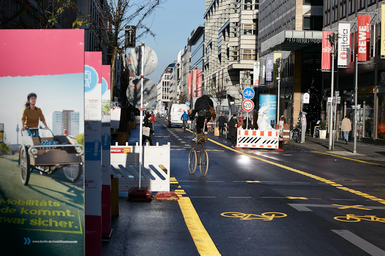The car-free section of Friedrichstrasse in Berlin-Mitte. Marked bicycle lanes run along the middle of the street.