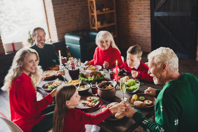 A family of six having Christmas dinner