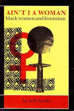A book cover shows the symbol for female under the title 'Ain't I A Woman'