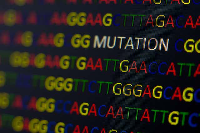 DNA sequence with colored letters on black background with the word "mutation."