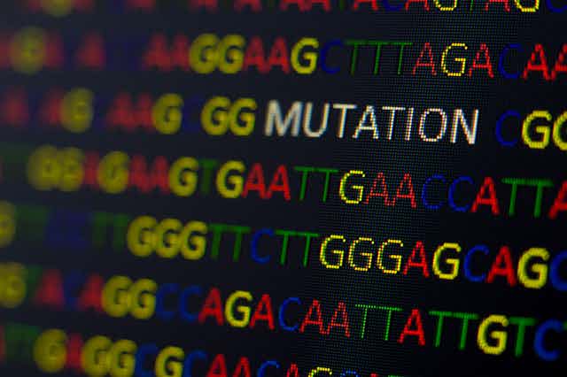 DNA sequence with colored letters on black background with the word "mutation."