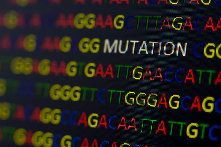 DNA sequence with colored letters on black background with the word "mutation."