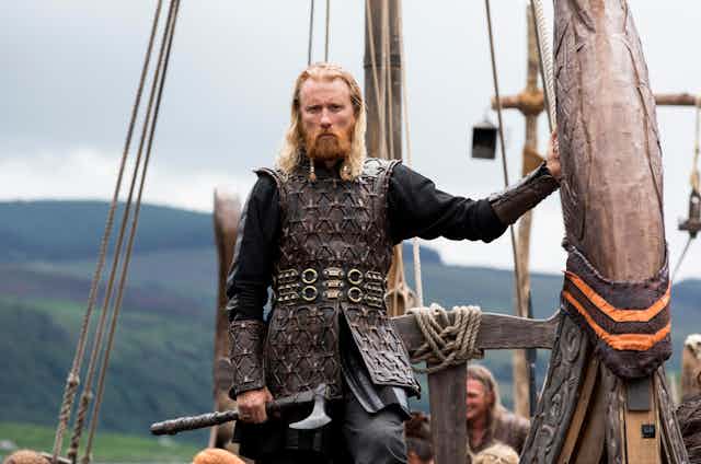 A viking on a ship.