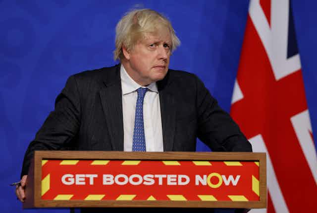 Boris Johnson looks concerned during a press briefing. 
