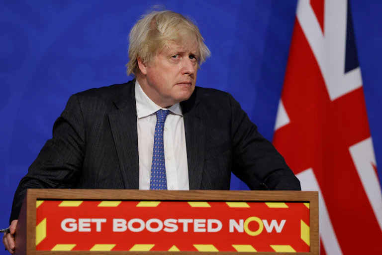 Boris Johnson looks concerned during a press briefing.