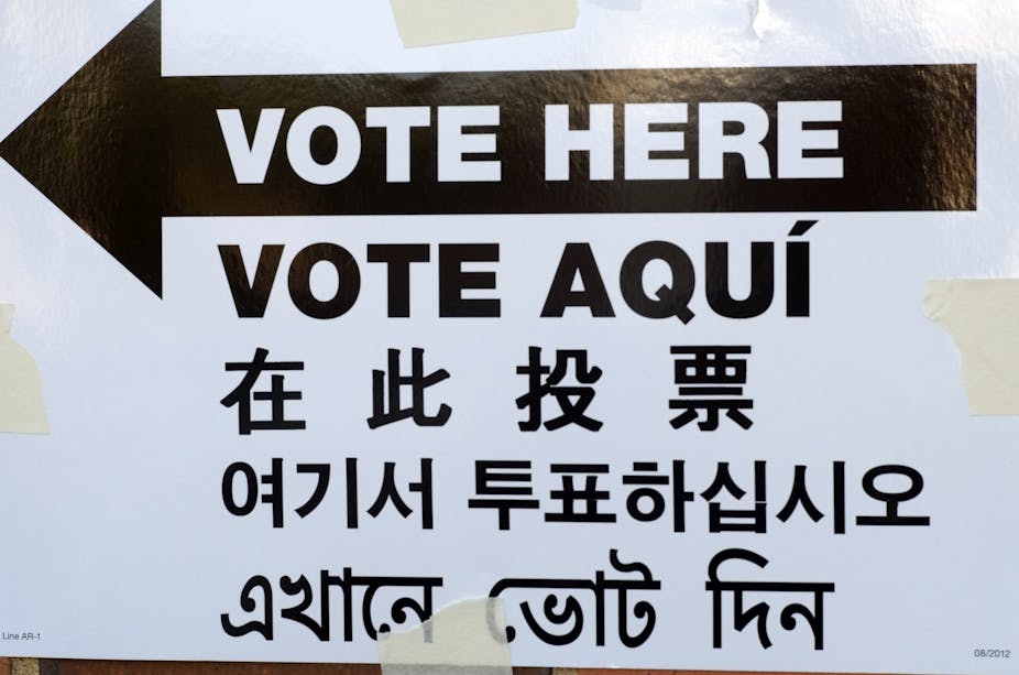 A sign says "vote here" in many languages