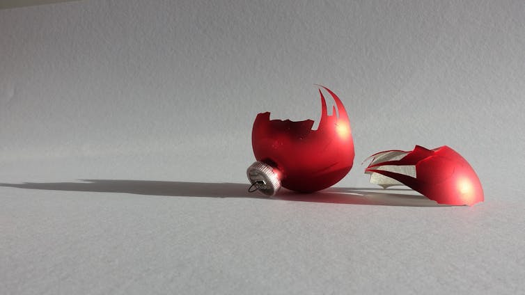 A broken red Christmas ornament