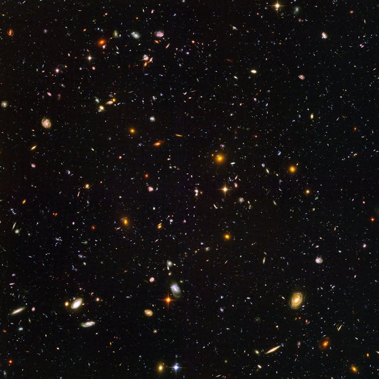 Abell 370 is a cluster of hundreds of galaxies about five billion light years away from Earth. NASA, ESA, and J. Lotz and the HFF Team (STScI)