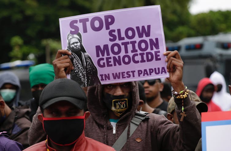 Papuan people march in Jakarta to protest their treatment at the hands of Indonesians.