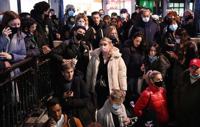 Commuters waiting to enter Oxford Street tube station.