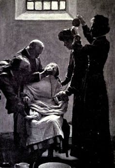 Force feeding a suffragette.