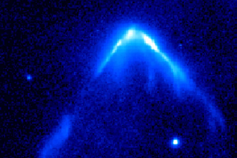 Telescopic view of blazing light in an inverted 'v' shape with a bright star at the front.