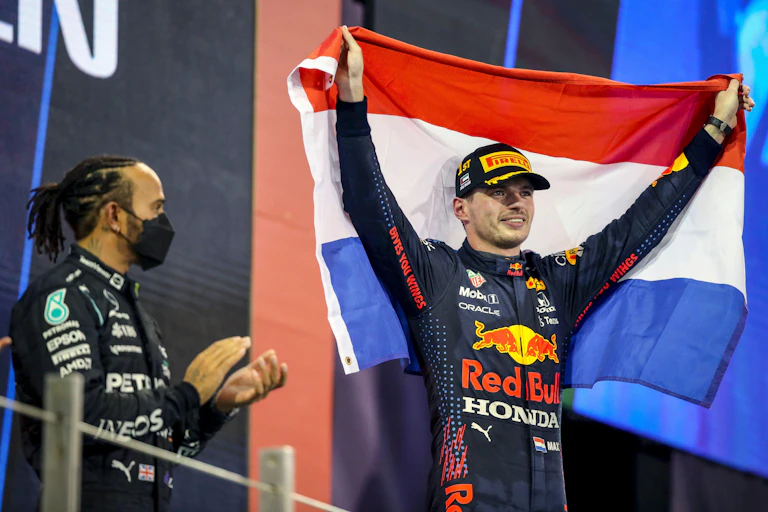 Lewis Hamilton applauds his rival's victory.