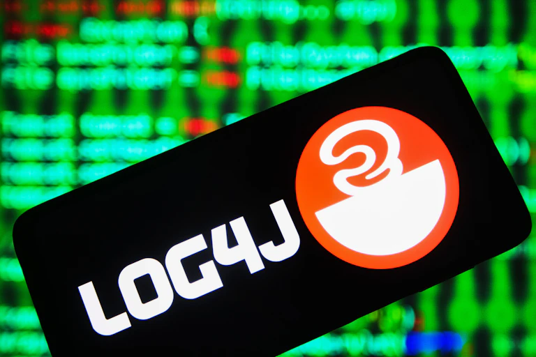 a black rectangle containing a logo tilted at an angle against a background of colored lights