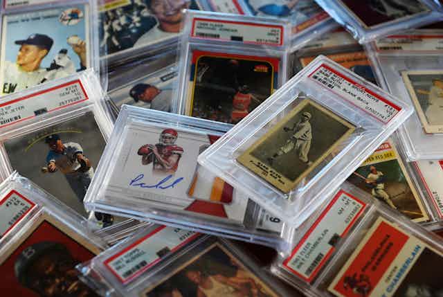 A pile of sports trading cards.