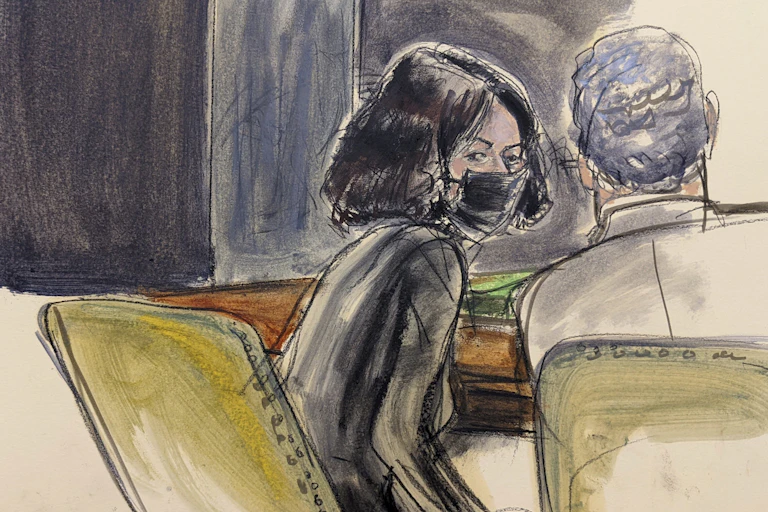 A court artist's impression of Ghislaine Maxwell in court wearing a mask and looking back over her shoulder.