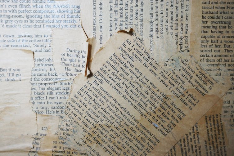 Pages from a book stuck to a wall