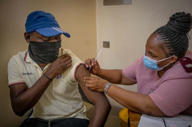 A man receives a COVID jab at a clinic in Johannesburg