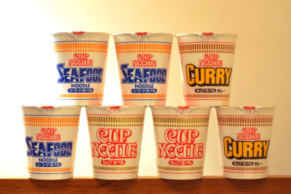 Different flavors of Cup Noodles stacked on one another.