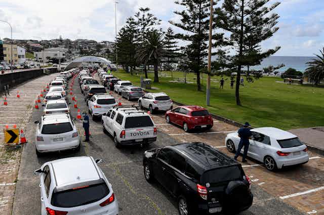 A long queue at a drive-through COVID testing site in Sydney