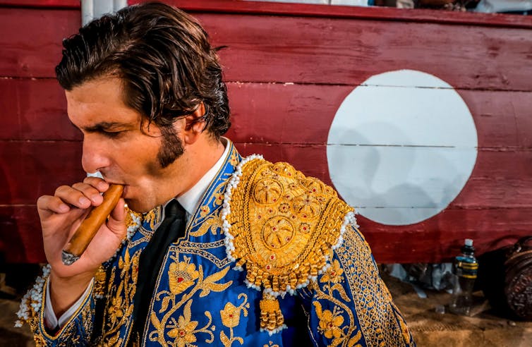 Matador Morante de la Puebla smoking a cigar.