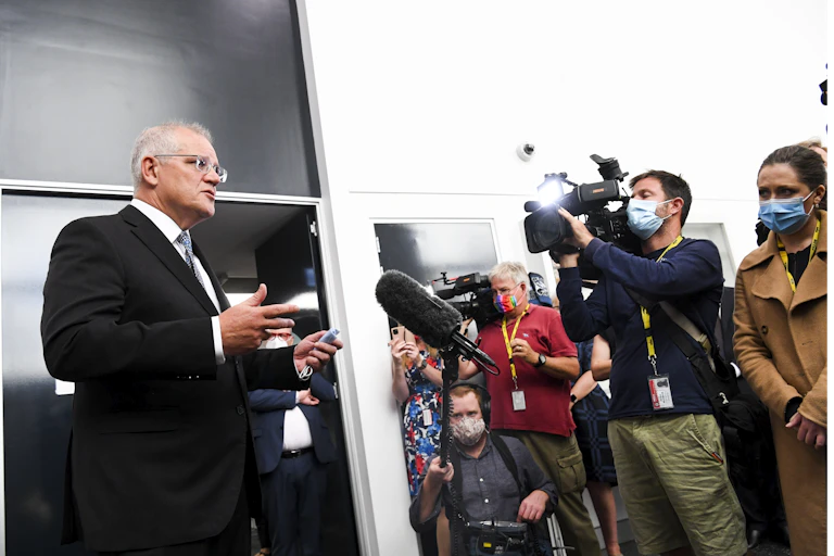 Scott Morrison address the media